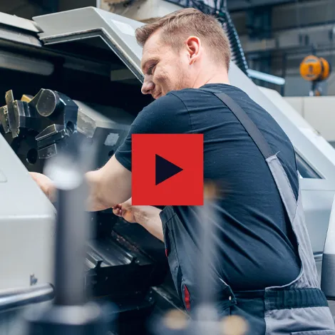 Extreme Precision Screw Products Employee Working a Lathe Click to Play Video