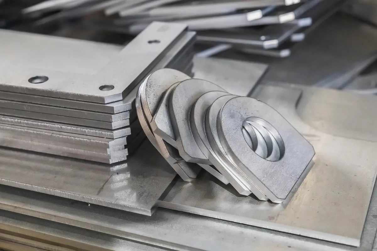 Laser cut iron parts in factory warehouse Laser cut iron parts in factory warehouse