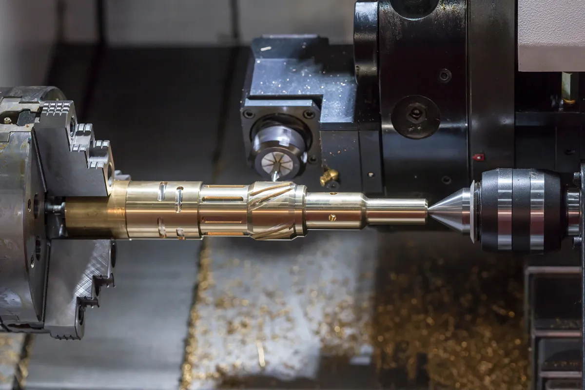 The CNC lathe machine cutting the brass shaft part by milling spindle. The CNC lathe machine cutting the brass shaft part by milling spindle.